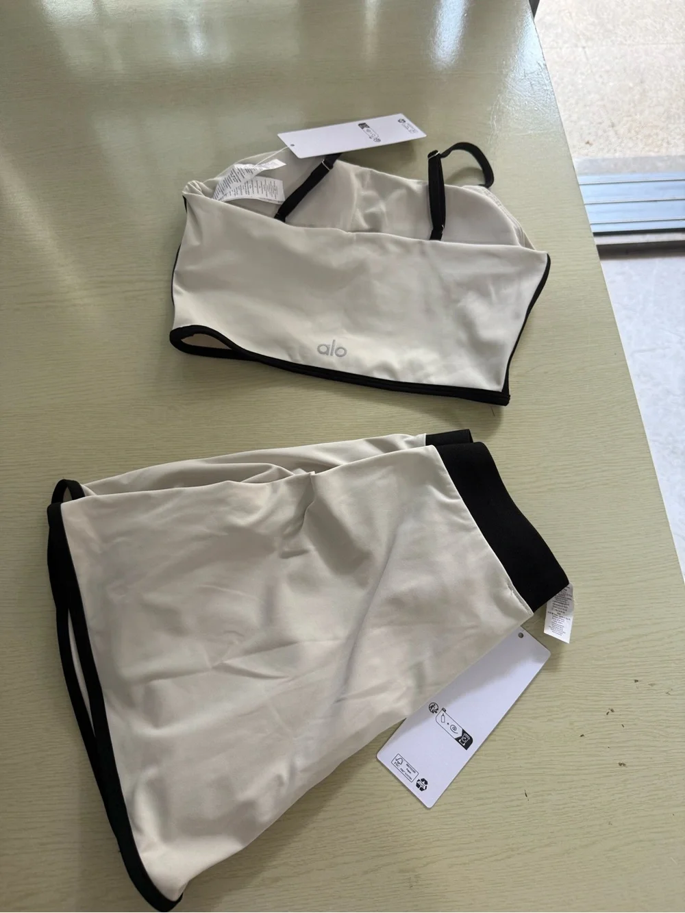 ALO Yoga Cream Sports Bra and Skort with Black Trim - Picture 4 of 6